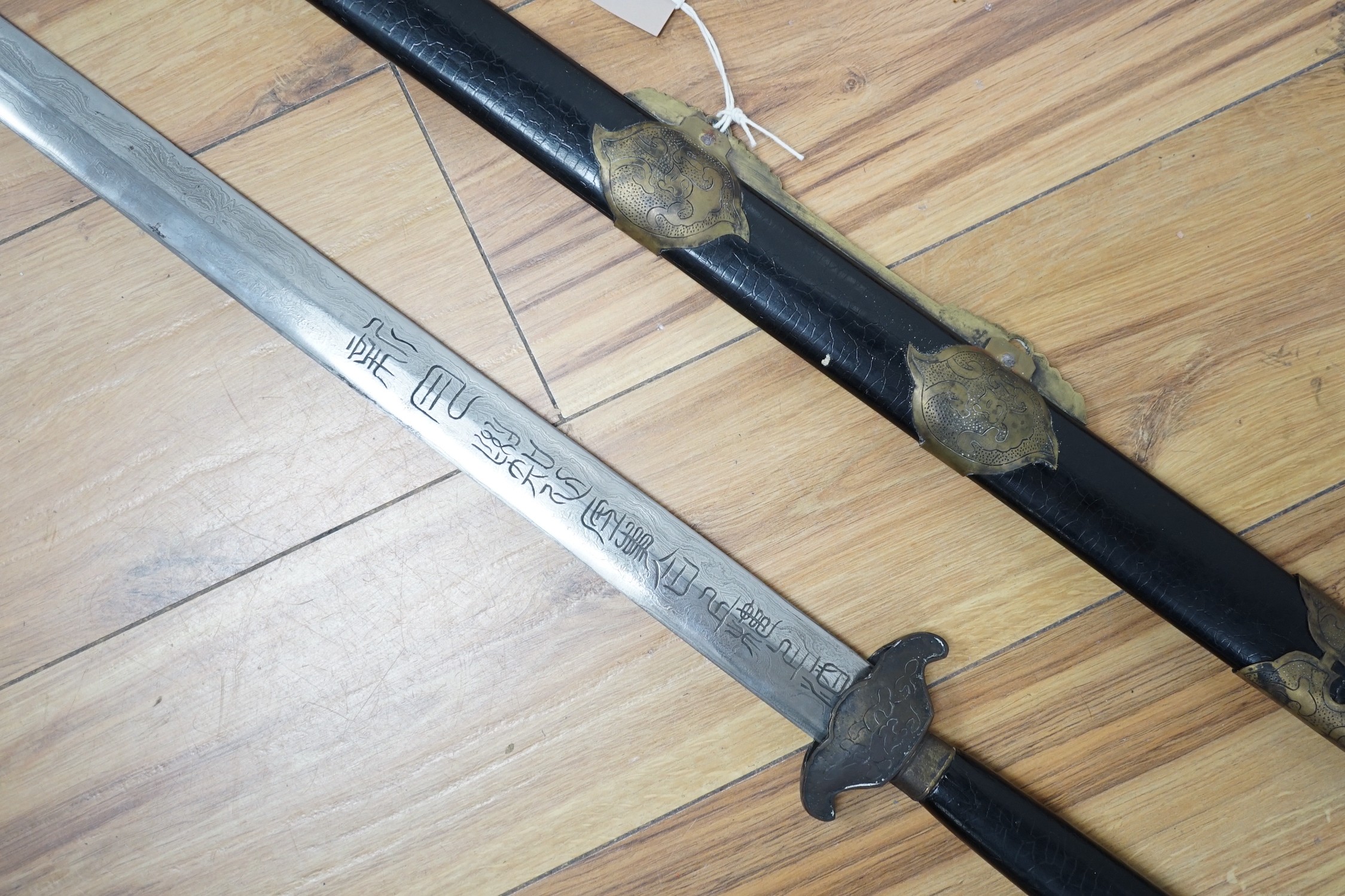A Chinese shuangshou jian (two handed sword) 137cm total length including scabbard